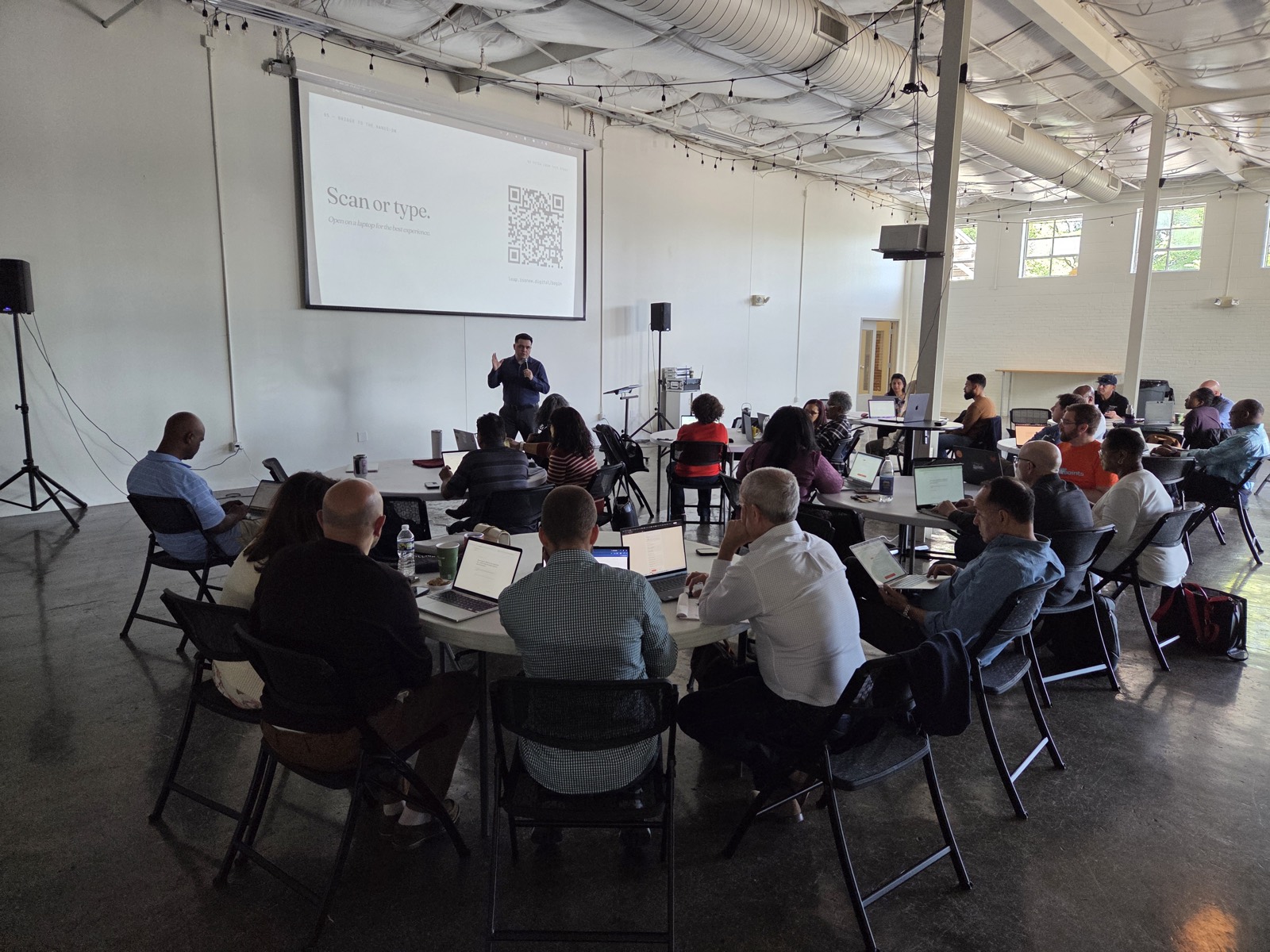 Operators working at round tables during the last LEAP session
